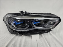 Load image into Gallery viewer, This image displays the right-side Laser headlight for BMW models X5 G05, X5 M F95, X6 G06, and X6 M F96, featuring OEM genuine quality with part number 5A27998. This used original headlamp delivers cutting-edge BMW Laserlight technology, offering enhanced night visibility, precise fitment, and a sleek, high-performance design tailored for these luxury SUV models.