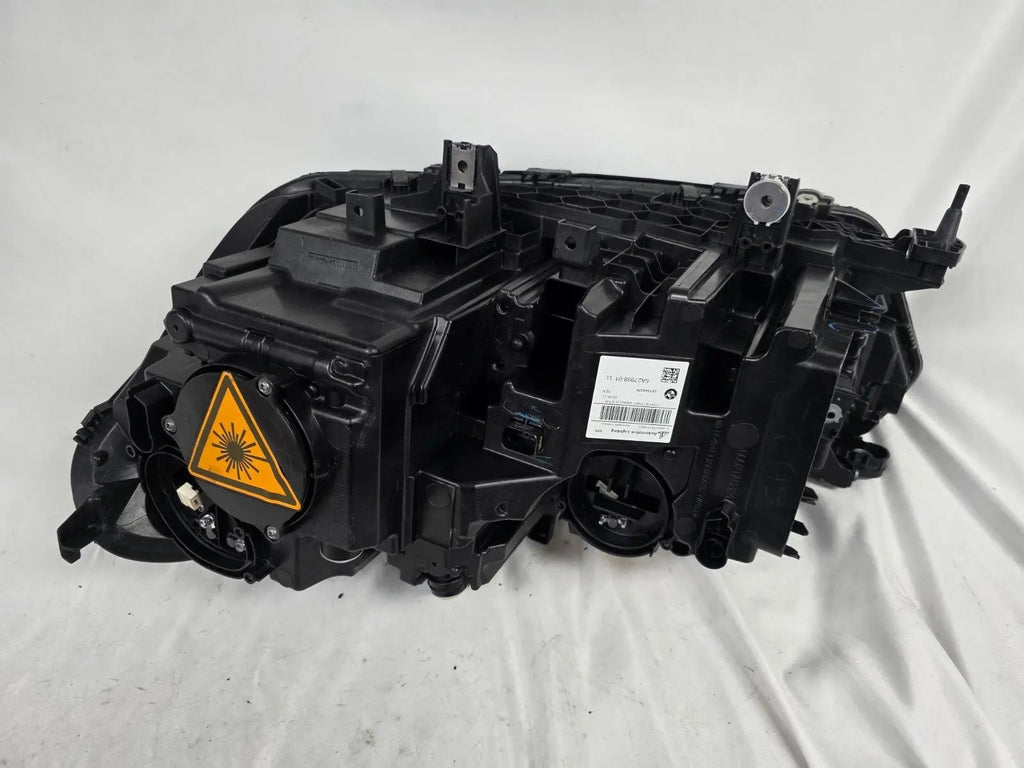 This image displays the right-side Laser headlight for BMW models X5 G05, X5 M F95, X6 G06, and X6 M F96, featuring OEM genuine quality with part number 5A27998. This used original headlamp delivers cutting-edge BMW Laserlight technology, offering enhanced night visibility, precise fitment, and a sleek, high-performance design tailored for these luxury SUV models.