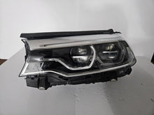 Load image into Gallery viewer, This image shows the left-side Adaptive LED ICON headlight for the BMW 5 Series G30, G31, G38, and F90 LCI models, featuring OEM genuine quality with part number 8499121. This used original headlamp is designed for the facelifted (LCI) versions of these models, offering BMW’s signature Adaptive LED ICON lighting technology for enhanced visibility, precise beam control, and a sleek, modern design.