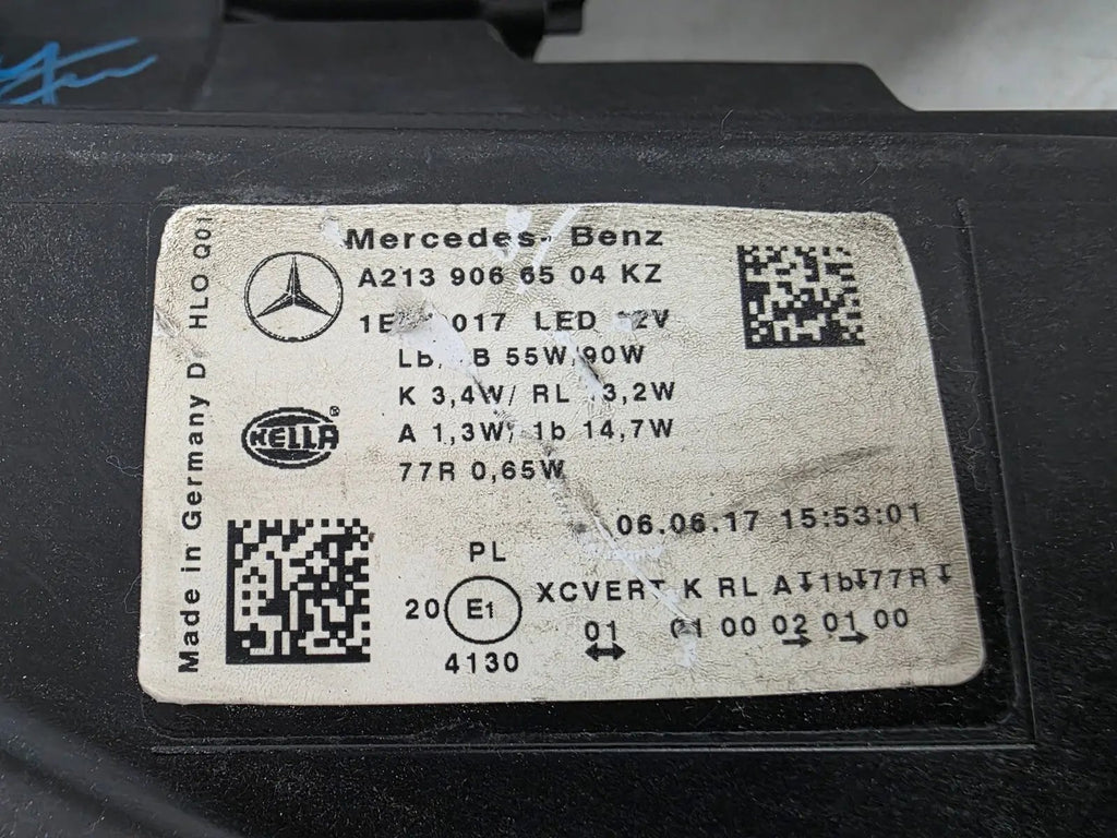 This image displays the left-side Multibeam LED headlight with blue accents for the Mercedes-Benz E-Class W213, featuring OEM genuine quality and part number A2139066504. This original used headlamp is designed for precise fitment on the W213 model, offering advanced Multibeam LED technology with distinctive blue detailing for high-performance adaptive illumination and premium styling