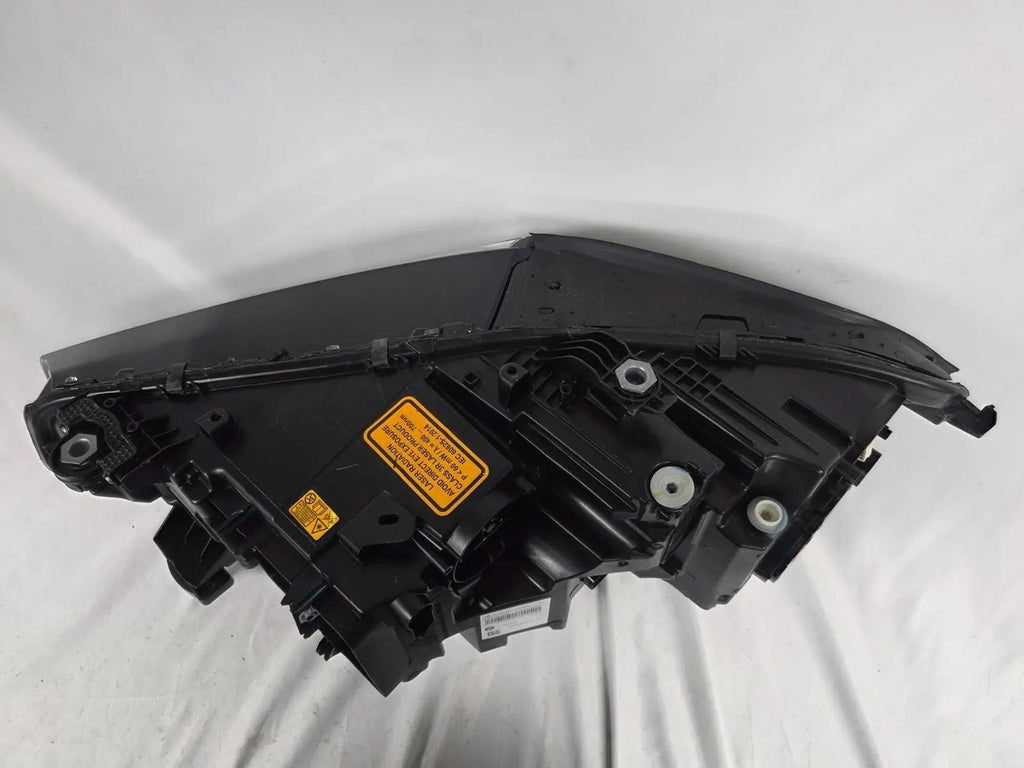 This image displays the right-side Laser headlight for BMW models X5 G05, X5 M F95, X6 G06, and X6 M F96, featuring OEM genuine quality with part number 5A27998. This used original headlamp delivers cutting-edge BMW Laserlight technology, offering enhanced night visibility, precise fitment, and a sleek, high-performance design tailored for these luxury SUV models.