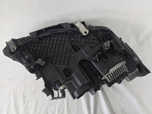 Load image into Gallery viewer, Genuine OEM BMW Laser headlight for 5 Series models G30, G31, and F90 LCI (facelift). This left-side headlamp, part number 5A388D5, is equipped with advanced laser lighting technology for superior visibility and precision on the road. The image displays the original left laser headlight in used condition, clearly showing the lens structure, cooling fins, mounting points, and connector ports — ideal for OEM replacement on compatible BMW 5 Series LCI vehicles.