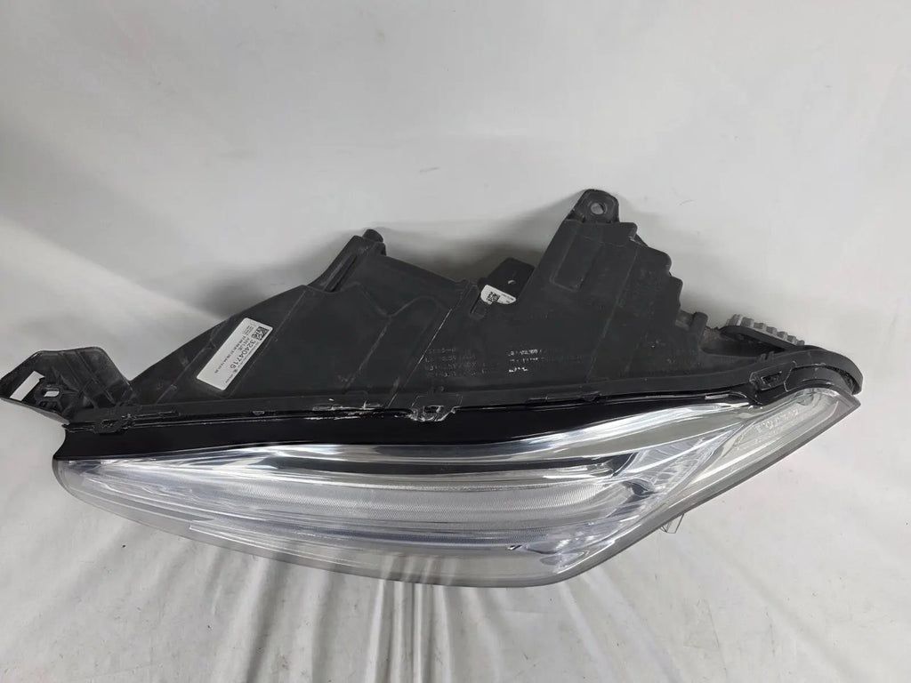 This image features the left-side Xenon headlight for the Volvo XC90, showcasing OEM genuine quality with part number 32404715. This used original headlamp is designed for accurate fitment and delivers powerful Xenon illumination, ensuring optimal visibility, durability, and premium performance for the XC90 luxury SUV