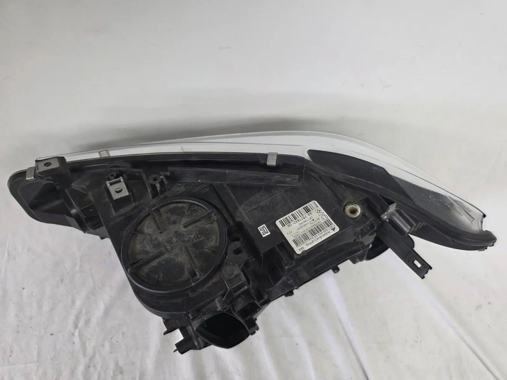 Genuine used BMW Adaptive LED headlight for 4 Series models F32, F33, F36, F80 LCI, F82, and F83. This right-side OEM headlamp, part number 7377842, is designed with adaptive lighting technology for improved visibility and performance. The image highlights the complete original headlight unit in used condition, including the clear lens, mounting points, and electrical connectors — ideal for replacement on compatible BMW models.