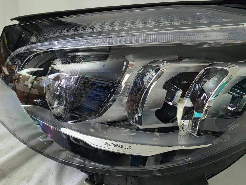 This image features the left-side Multibeam LED headlight for the Mercedes-Benz C-Class W205 Facelift (FL) model, with OEM genuine quality and part number A2059061506. This used original headlamp is designed for a perfect fit on the facelifted W205, delivering advanced Multibeam LED technology for precise, adaptive lighting and optimal driving visibility