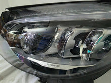 Load image into Gallery viewer, This image features the left-side Multibeam LED headlight for the Mercedes-Benz C-Class W205 Facelift (FL) model, with OEM genuine quality and part number A2059061506. This used original headlamp is designed for a perfect fit on the facelifted W205, delivering advanced Multibeam LED technology for precise, adaptive lighting and optimal driving visibility