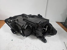 Load image into Gallery viewer, This image shows the left-side Xenon headlight for the Mercedes-Benz CLA Class C117, featuring original OEM quality with part number A1179065100. The headlight is a used but genuine component, designed to perfectly fit the left side of the CLA C117 model. It includes the factory-built Xenon lighting system and showcases the durable construction expected from Mercedes-Benz parts.