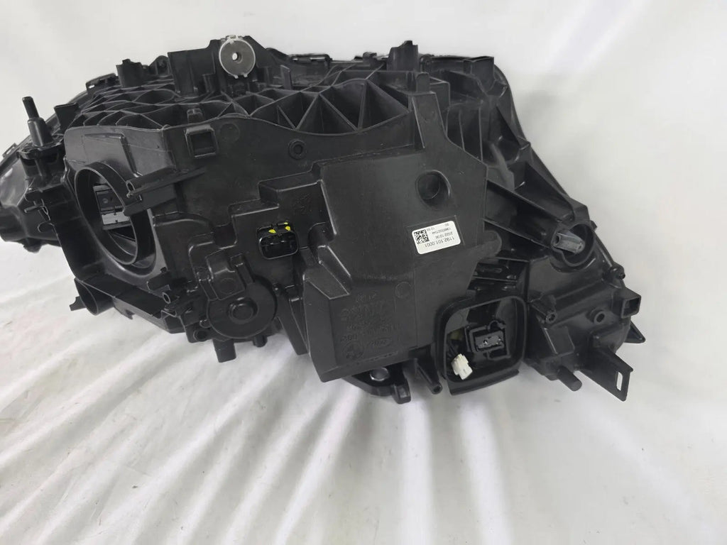 Used genuine BMW LED headlight for 4 Series models including G22, G23, G26, G80, G82, and G83. This left-side OEM headlamp, part number 9851035, is designed to perfectly fit and function in compatible BMW vehicles. The image shows the original BMW LED headlight in used condition with visible connectors, housing, and lens – ideal for replacement or repair of your vehicle’s front lighting system.
