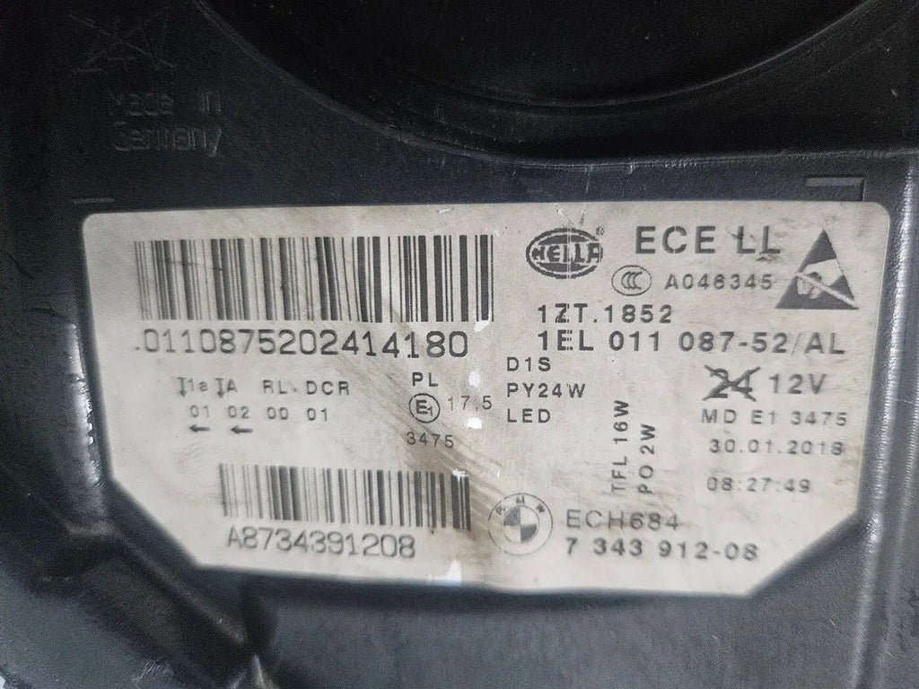 This image displays the right-side Xenon headlight for the BMW 5 Series F18 LCI, F10 LCI, and F11 LCI models, featuring OEM genuine quality with part number 7343912. This used original headlamp is designed specifically for the facelifted (LCI) versions, offering precise fitment, powerful Xenon illumination, and the premium durability expected from authentic BMW components.