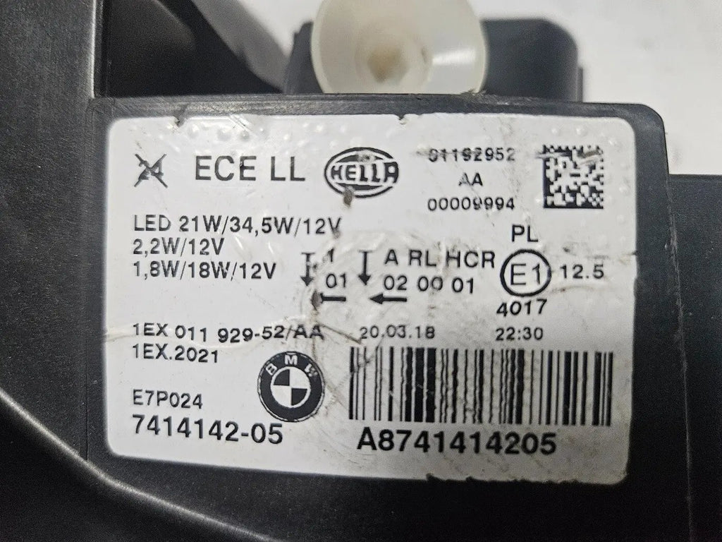 This image displays the right-side LED headlight for the BMW 1 Series F20 and F21 LCI (facelift) models, featuring OEM genuine quality with part number 7414142. This used original headlamp is engineered for a precise fit on the facelifted 1 Series, offering bright LED illumination, modern styling, and reliable performance from an authentic BMW component