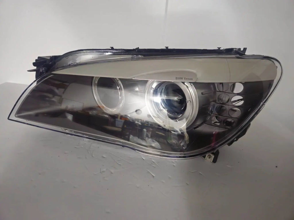 This image features the left-side Xenon headlight for the BMW 7 Series F01/F02 models, showcasing used OEM genuine quality with part number 7225229. Designed specifically for the F01 and F02 chassis, this original headlamp offers high-intensity Xenon lighting and precise fitment for the left side, ensuring reliable performance and compatibility.