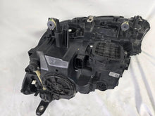 Load image into Gallery viewer, Used genuine BMW Laser headlight for 7 Series models G11 and G12. This right-side OEM headlamp, part number 7465606, features advanced laser lighting technology for superior visibility and performance. The image shows the original BMW right laser headlight in used condition, highlighting the detailed lens design, housing structure, and connector ports — ideal for high-end replacement or repair on compatible 7 Series vehicles.