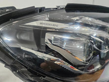 Load image into Gallery viewer, This image features the right-side LED High Performance headlight for the Mercedes-Benz E-Class W213, showcasing OEM genuine quality with part number A2139064004. Specifically designed for the W213 model, this used headlight offers high-performance LED illumination and is an original Mercedes-Benz component, ensuring precise fit and reliable functionality