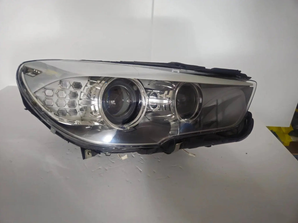 This image shows the right-side Bi-Xenon headlight for the BMW 5 Series GT F07 model, featuring OEM genuine quality with part number 7262720. It is a used original headlight designed for precise fit on the right side of the BMW F07 Gran Turismo, offering advanced Bi-Xenon lighting performance and durable OEM construction