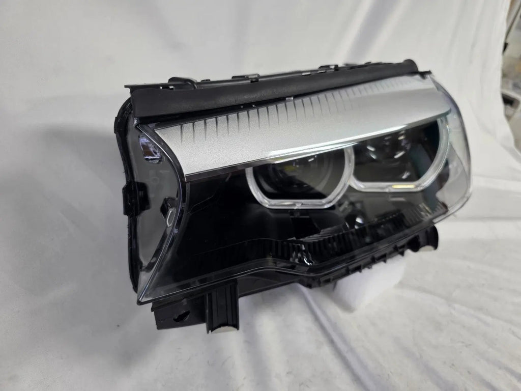 This image shows the left-side LED headlight for the BMW 5 Series G30 and G31 models, featuring OEM genuine quality with part number 7439199. This used original headlamp is engineered for a precise fit on the left side, offering bright and efficient LED illumination, modern styling, and the reliable performance expected from BMW components.