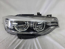 Load image into Gallery viewer, Genuine used BMW Adaptive LED headlight for 4 Series models F32, F33, F36, F80 LCI, F82, and F83. This right-side OEM headlamp, part number 7377842, is designed with adaptive lighting technology for improved visibility and performance. The image highlights the complete original headlight unit in used condition, including the clear lens, mounting points, and electrical connectors — ideal for replacement on compatible BMW models.