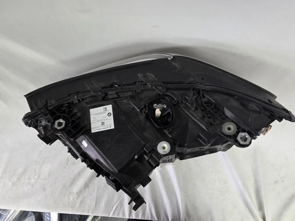 Genuine OEM Adaptive LED headlight for BMW iX3 and compatible models including G08, G01, F97, G02, and F98 with LCI (facelift) updates. This right-side headlamp, part number 5A29204, features adaptive lighting technology for enhanced road illumination and driving safety. The image showcases the original right LED headlight in used condition, clearly showing the lens, housing, and connector points — perfect for replacement on BMW iX3 and related LCI models.
