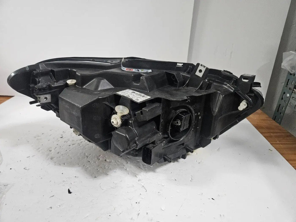 This image shows the left-side LED headlight for the BMW 1 Series F20 and F21 LCI (facelift) models, featuring OEM genuine quality with part number 7435777. This used original headlamp is specifically designed for the facelifted 1 Series, offering bright and efficient LED lighting, precise fitment, and the durability expected from authentic BMW components.