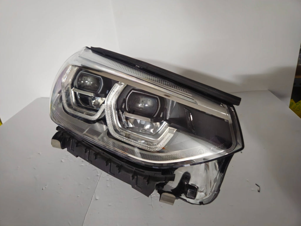 This image displays the right-side ICON Adaptive LED headlight for BMW models iX3 G08, X3 G01, X3 M F97, X4 G02, and X4 M F98, featuring OEM genuine quality with part number 7494052. This used original headlamp offers BMW’s advanced Adaptive LED with ICON design, delivering precise light distribution, dynamic styling, and perfect fitment for these specific models