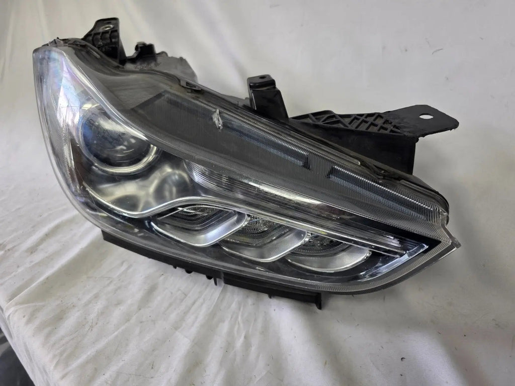 This image shows the right-side Xenon headlight for the Maserati Ghibli models from 2014 to 2017, featuring OEM genuine quality with part number 00670004658. This used original headlamp is designed for perfect fitment, delivering powerful Xenon lighting and the signature sleek styling expected from Maserati’s luxury performance vehicles