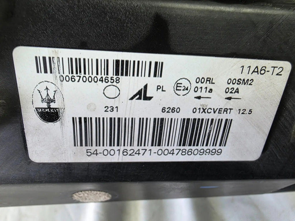 This image shows the right-side Xenon headlight for the Maserati Ghibli models from 2014 to 2017, featuring OEM genuine quality with part number 00670004658. This used original headlamp is designed for perfect fitment, delivering powerful Xenon lighting and the signature sleek styling expected from Maserati’s luxury performance vehicles