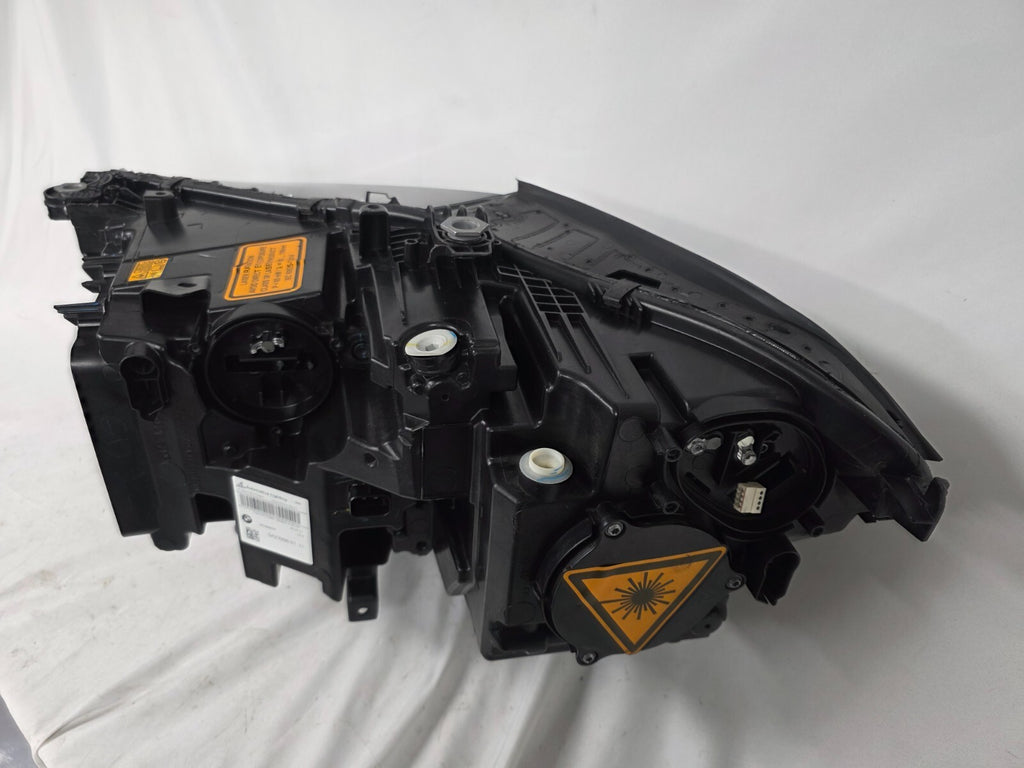This image displays the right-side Laser headlight for BMW models X5 G05, X5 M F95, X6 G06, and X6 M F96, featuring OEM genuine quality with part number 5A27998. This used original headlamp delivers cutting-edge BMW Laserlight technology, offering enhanced night visibility, precise fitment, and a sleek, high-performance design tailored for these luxury SUV models.
