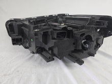 Load image into Gallery viewer, Used genuine BMW Adaptive LED headlight for X1 F48 LCI (facelift) model. This right-side OEM headlamp, part number 5A01178, is equipped with adaptive lighting technology for improved night visibility and cornering performance. The image displays the original right Adaptive LED headlight in used condition, showing the clear lens, mounting brackets, and electrical connectors — an ideal OEM replacement for BMW X1 F48 LCI vehicles.

