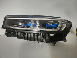 This image features the left-side Laser headlight for the BMW 7 Series G11 LCI and G12 LCI models, with OEM genuine quality and part number 9450229. Specifically designed for the facelifted (LCI) versions of the G11 and G12, this used original headlamp offers cutting-edge BMW Laserlight technology, precision fitment, and exceptional nighttime visibility, perfectly aligning with the luxury and performance of the 7 Series