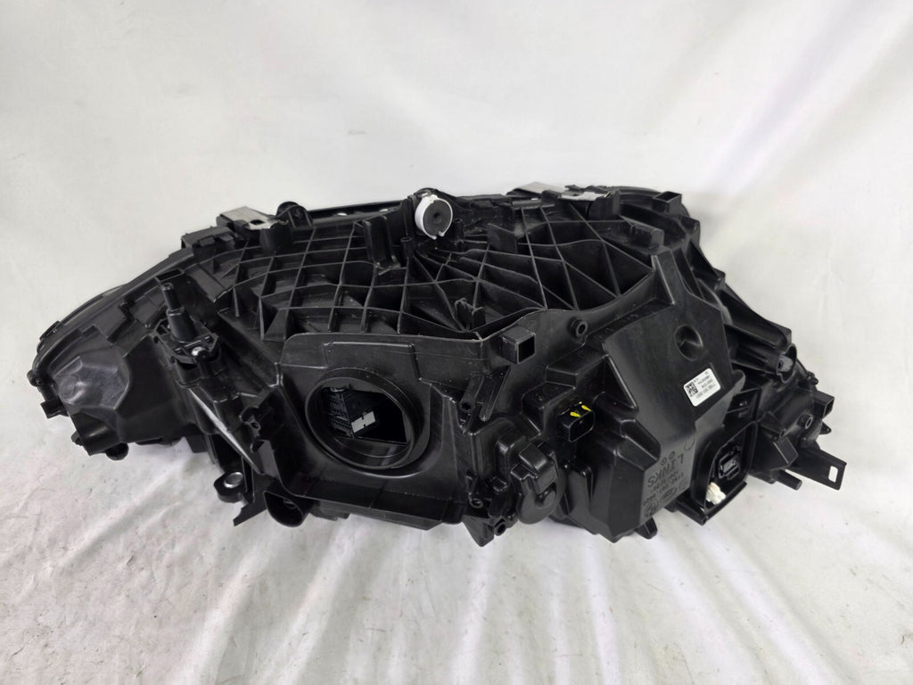 Used genuine BMW LED headlight for 4 Series models including G22, G23, G26, G80, G82, and G83. This left-side OEM headlamp, part number 9851035, is designed to perfectly fit and function in compatible BMW vehicles. The image shows the original BMW LED headlight in used condition with visible connectors, housing, and lens – ideal for replacement or repair of your vehicle’s front lighting system.