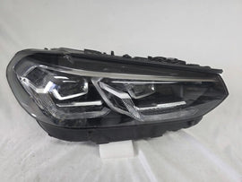 Genuine OEM Adaptive LED headlight for BMW iX3 and compatible models including G08, G01, F97, G02, and F98 with LCI (facelift) updates. This right-side headlamp, part number 5A29204, features adaptive lighting technology for enhanced road illumination and driving safety. The image showcases the original right LED headlight in used condition, clearly showing the lens, housing, and connector points — perfect for replacement on BMW iX3 and related LCI models.