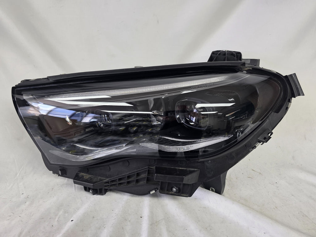 This image shows the left-side DIGITAL LIGHT headlight for the Mercedes-Benz E-Class W214, featuring OEM genuine quality with part number A2149066102. Designed for a precise fit on the left side of the W214 model, this used original headlamp offers Mercedes-Benz’s advanced DIGITAL LIGHT technology for superior adaptive illumination and driving safety.
