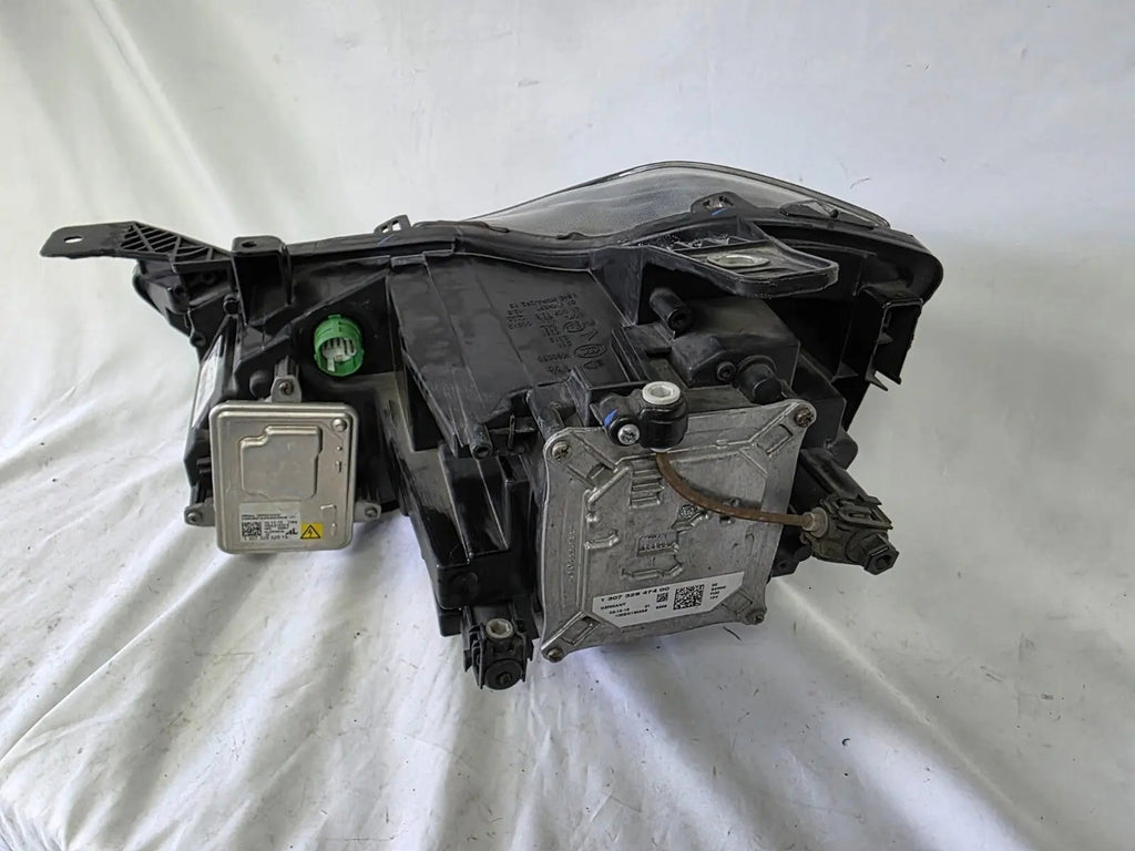 This image shows the right-side Xenon headlight for the Maserati Ghibli models from 2014 to 2017, featuring OEM genuine quality with part number 00670004658. This used original headlamp is designed for perfect fitment, delivering powerful Xenon lighting and the signature sleek styling expected from Maserati’s luxury performance vehicles