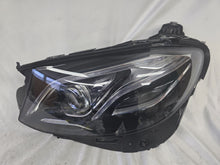 Load image into Gallery viewer, This image displays the left-side Multibeam LED headlight with blue accents for the Mercedes-Benz E-Class W213, featuring OEM genuine quality and part number A2139066504. This original used headlamp is designed for precise fitment on the W213 model, offering advanced Multibeam LED technology with distinctive blue detailing for high-performance adaptive illumination and premium styling