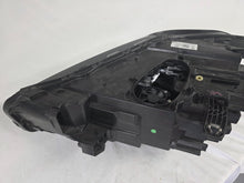 Load image into Gallery viewer, Used genuine BMW Adaptive LED headlight for X1 F48 LCI (facelift) model. This right-side OEM headlamp, part number 5A01178, is equipped with adaptive lighting technology for improved night visibility and cornering performance. The image displays the original right Adaptive LED headlight in used condition, showing the clear lens, mounting brackets, and electrical connectors — an ideal OEM replacement for BMW X1 F48 LCI vehicles.

