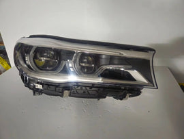 This image features the right-side Adaptive LED headlight (ICON design) for the BMW 7 Series G11 and G12 models, showcasing OEM genuine quality with part number 7408710. This used original headlamp offers BMW’s signature Adaptive LED with ICON styling, providing dynamic lighting performance, precise fitment, and premium functionality tailored for the luxury 7 Series lineup.
