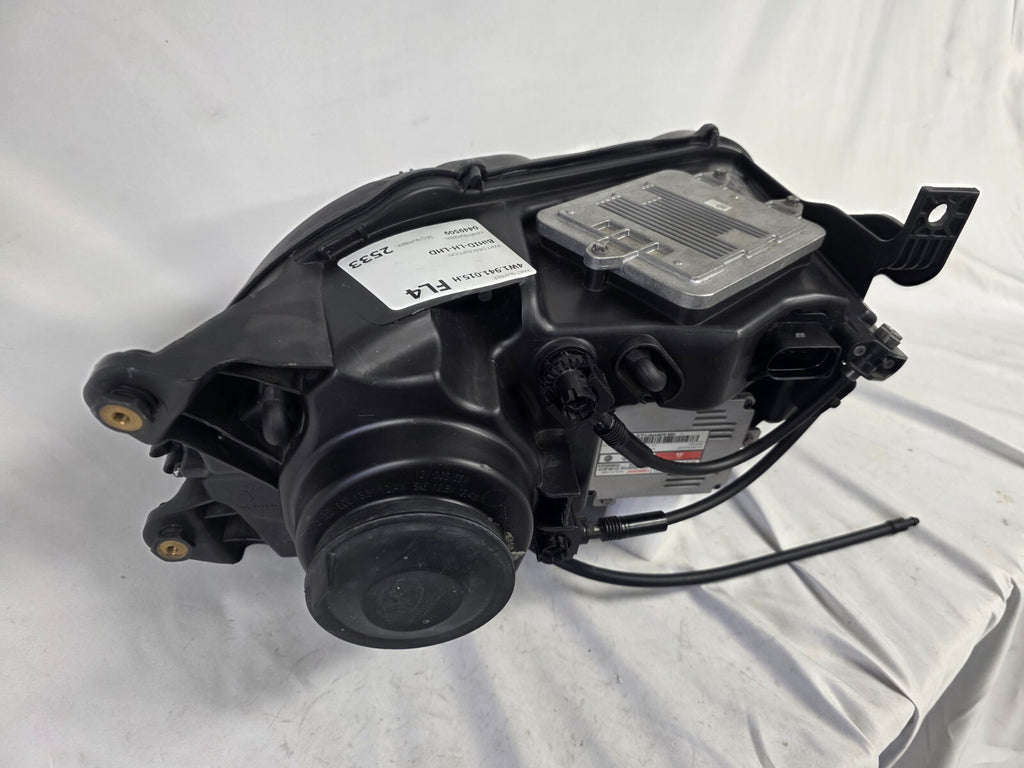 This image shows the left-side headlight for the 2014–2019 Bentley Flying Spur, featuring OEM genuine quality with part number 4W1941015H. This used original headlamp is in excellent condition, offering premium illumination, elegant design, and a precise fit for Bentley’s high-end luxury sedan