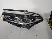 Load image into Gallery viewer, This image shows the left-side Adaptive LED ICON headlight for the BMW 5 Series G30, G31, G38, and F90 LCI models, featuring OEM genuine quality with part number 8499121. This used original headlamp is designed for the facelifted (LCI) versions of these models, offering BMW’s signature Adaptive LED ICON lighting technology for enhanced visibility, precise beam control, and a sleek, modern design.