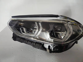 This image shows the left-side ICON Adaptive LED headlight for BMW models iX3 G08, X3 G01, X3 M F97, X4 G02, and X4 M F98, featuring OEM genuine quality with part number 7466119. This used original headlamp is designed to deliver BMW’s signature Adaptive LED lighting with ICON styling, ensuring precise fitment, enhanced visibility, and modern aesthetics for these high-performance models.
