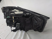 Load image into Gallery viewer, Genuine OEM BMW Laser headlight for 5 Series models G30, G31, and F90 LCI (facelift). This left-side headlamp, part number 5A388D5, is equipped with advanced laser lighting technology for superior visibility and precision on the road. The image displays the original left laser headlight in used condition, clearly showing the lens structure, cooling fins, mounting points, and connector ports — ideal for OEM replacement on compatible BMW 5 Series LCI vehicles.

