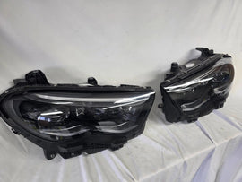 This image showcases the OEM genuine DIGITAL LIGHT headlights for the Mercedes-Benz E-Class W214, available for both right and left sides with part numbers A2149066102 (right) and A2149066202 (left). These advanced headlamps are original Mercedes-Benz components designed for the W214 model, offering cutting-edge DIGITAL LIGHT technology that enhances driving safety and precision lighting. The headlights are used but maintain high-quality OEM standards and are ideal replacements for the corresponding side.