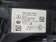 Load image into Gallery viewer, This image features the right-side LED High Performance headlight for the Mercedes-Benz E-Class W213, showcasing OEM genuine quality with part number A2139064004. Specifically designed for the W213 model, this used headlight offers high-performance LED illumination and is an original Mercedes-Benz component, ensuring precise fit and reliable functionality