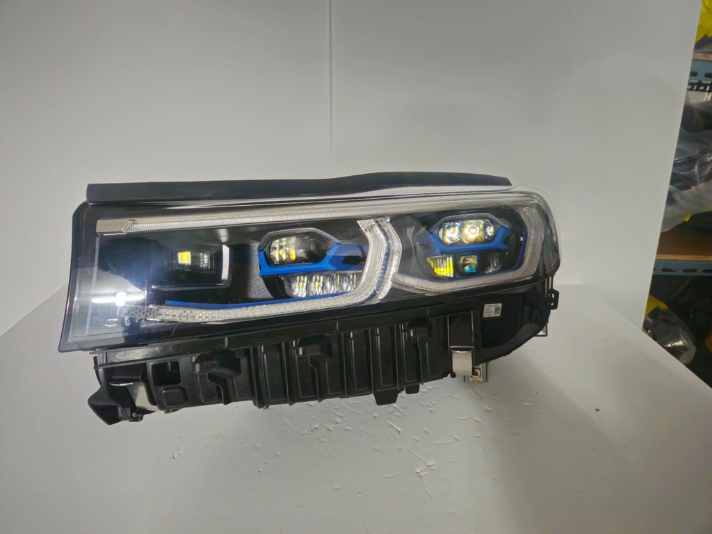 This image features the left-side Laser headlight for the BMW 7 Series G11 LCI and G12 LCI models, with OEM genuine quality and part number 9450229. Specifically designed for the facelifted (LCI) versions of the G11 and G12, this used original headlamp offers cutting-edge BMW Laserlight technology, precision fitment, and exceptional nighttime visibility, perfectly aligning with the luxury and performance of the 7 Series
