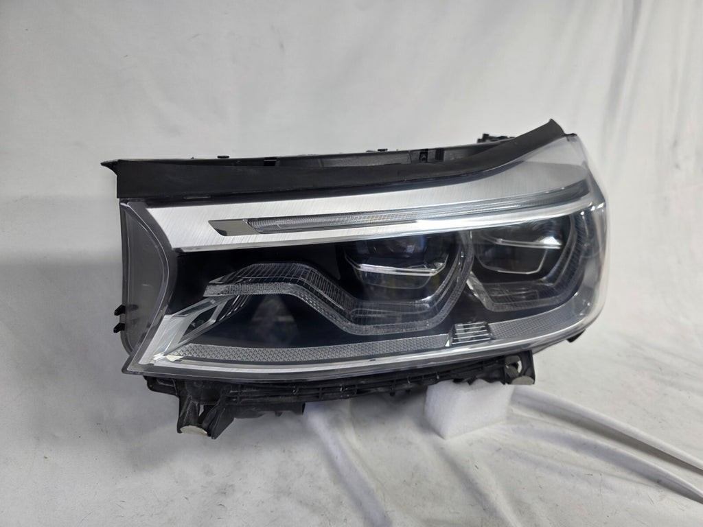 This image shows the left-side Adaptive LED headlight (ICON design) for the BMW 6 Series GT G32 model, featuring OEM genuine quality with part number 7496443. This used original headlamp is designed to deliver advanced Adaptive LED lighting with BMW’s ICON styling, offering precise fitment, enhanced road illumination, and premium performance for the 6 Series Gran Turismo.