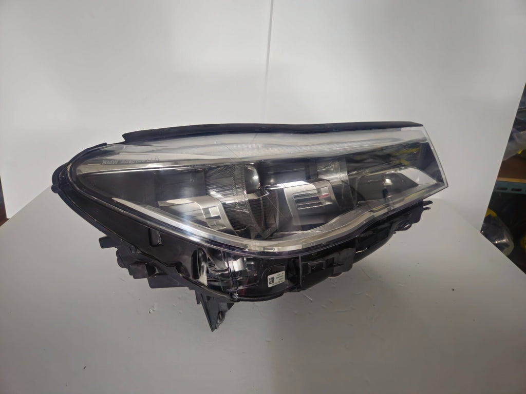 This image features the right-side Adaptive LED headlight (ICON design) for the BMW 7 Series G11 and G12 models, showcasing OEM genuine quality with part number 7408710. This used original headlamp offers BMW’s signature Adaptive LED with ICON styling, providing dynamic lighting performance, precise fitment, and premium functionality tailored for the luxury 7 Series lineup.