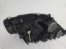 Load image into Gallery viewer, Genuine OEM BMW Laser headlight for 5 Series models G30, G31, and F90 LCI (facelift). This left-side headlamp, part number 5A388D5, is equipped with advanced laser lighting technology for superior visibility and precision on the road. The image displays the original left laser headlight in used condition, clearly showing the lens structure, cooling fins, mounting points, and connector ports — ideal for OEM replacement on compatible BMW 5 Series LCI vehicles.

