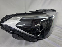 Load image into Gallery viewer, Used genuine BMW Adaptive LED headlight for X1 F48 LCI (facelift) model. This right-side OEM headlamp, part number 5A01178, is equipped with adaptive lighting technology for improved night visibility and cornering performance. The image displays the original right Adaptive LED headlight in used condition, showing the clear lens, mounting brackets, and electrical connectors — an ideal OEM replacement for BMW X1 F48 LCI vehicles.

