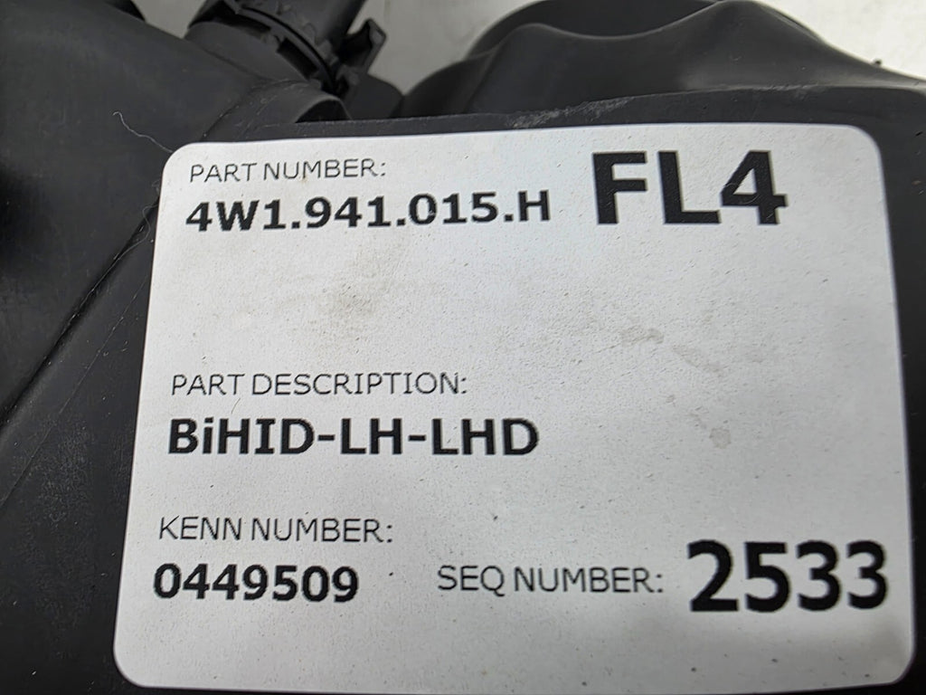 This image shows the left-side headlight for the 2014–2019 Bentley Flying Spur, featuring OEM genuine quality with part number 4W1941015H. This used original headlamp is in excellent condition, offering premium illumination, elegant design, and a precise fit for Bentley’s high-end luxury sedan