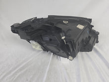Load image into Gallery viewer, This image displays the left-side Multibeam LED headlight with blue accents for the Mercedes-Benz E-Class W213, featuring OEM genuine quality and part number A2139066504. This original used headlamp is designed for precise fitment on the W213 model, offering advanced Multibeam LED technology with distinctive blue detailing for high-performance adaptive illumination and premium styling