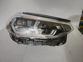 This image displays the right-side ICON Adaptive LED headlight for BMW models iX3 G08, X3 G01, X3 M F97, X4 G02, and X4 M F98, featuring OEM genuine quality with part number 7494052. This used original headlamp offers BMW’s advanced Adaptive LED with ICON design, delivering precise light distribution, dynamic styling, and perfect fitment for these specific models