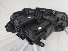 Load image into Gallery viewer, Used genuine BMW Adaptive LED headlight for X1 F48 LCI (facelift) model. This right-side OEM headlamp, part number 5A01178, is equipped with adaptive lighting technology for improved night visibility and cornering performance. The image displays the original right Adaptive LED headlight in used condition, showing the clear lens, mounting brackets, and electrical connectors — an ideal OEM replacement for BMW X1 F48 LCI vehicles.

